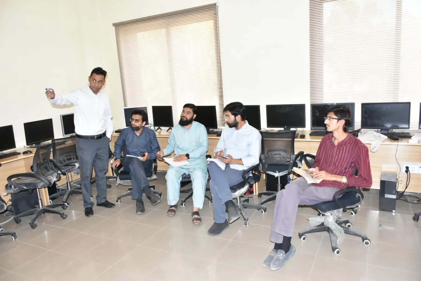 Muhammad Ibraheem conducting a training session with students